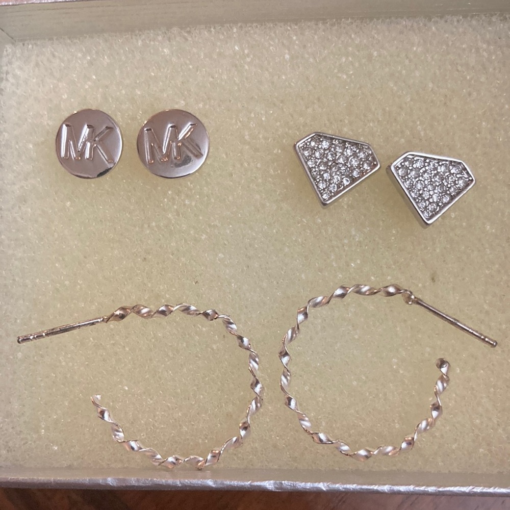 3 faux silver earrings